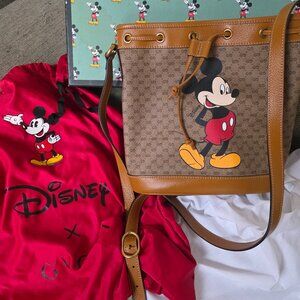 Gucci x Disney Mini GG Supreme Monogram bucket bag in bei
